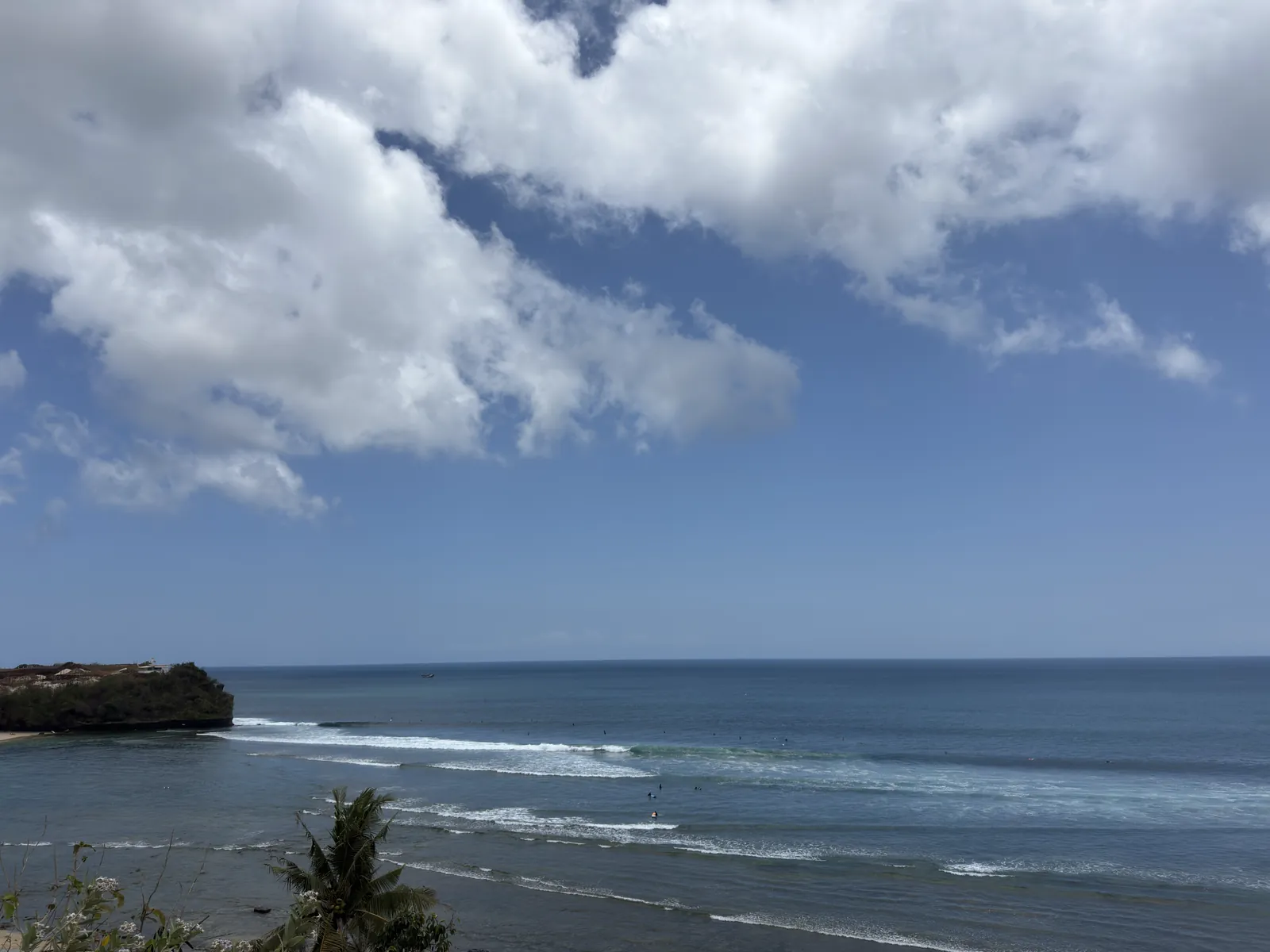 Waves rolling in along the shore at Balangan
