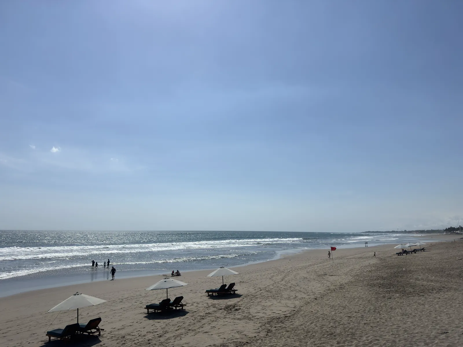 Sun loungers and umbrellas on the beach at Batu Belig