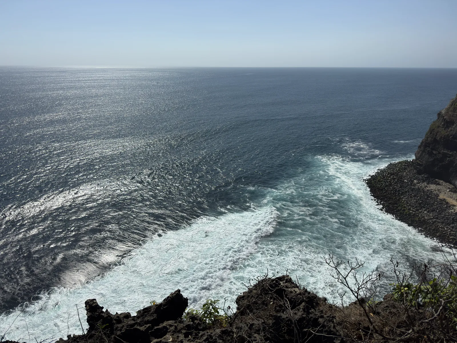 Waves breaking below the cliffs at Uluwatu
