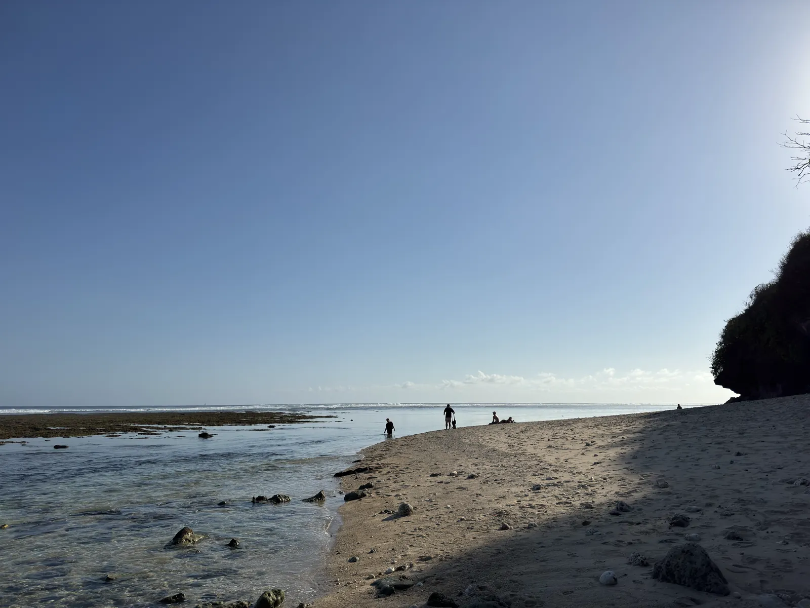 Low tide on a beach below the cliffs in Ungasan